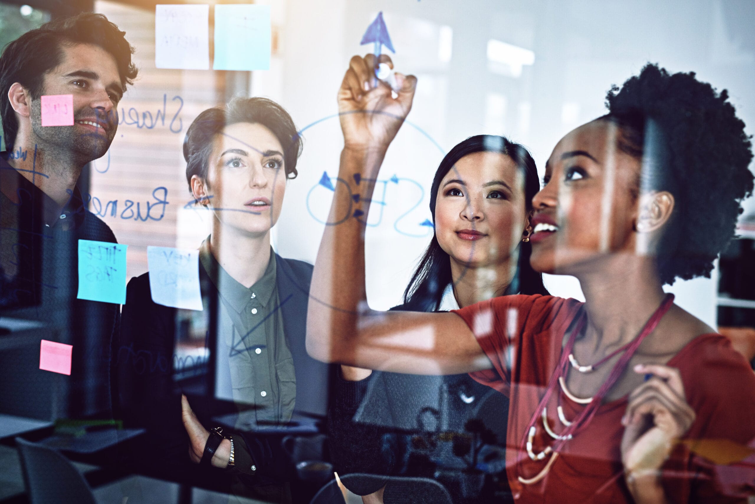 Professional team collaborating on healthcare IT strategies, illustrating the key skills of an IT consultant.
