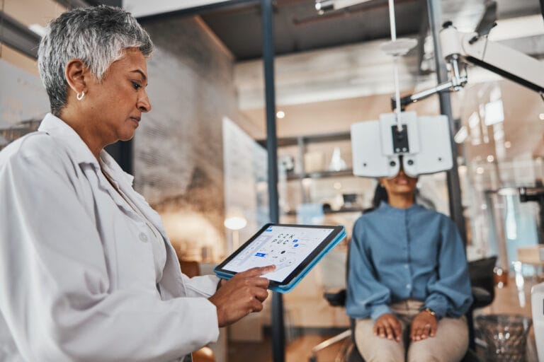 Healthcare professional using a tablet to optimize digital processes in a medical facility.